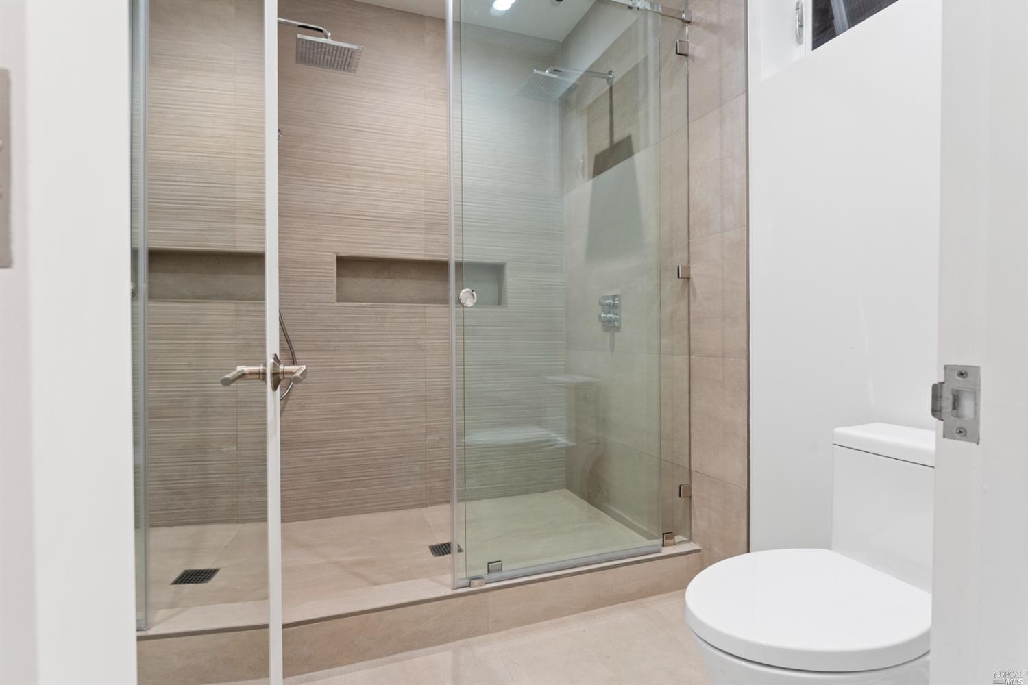 655 Edgewood Avenue Mill Valley, CA 94941 - Photo 24 of 85 a bathroom with a shower and toilet