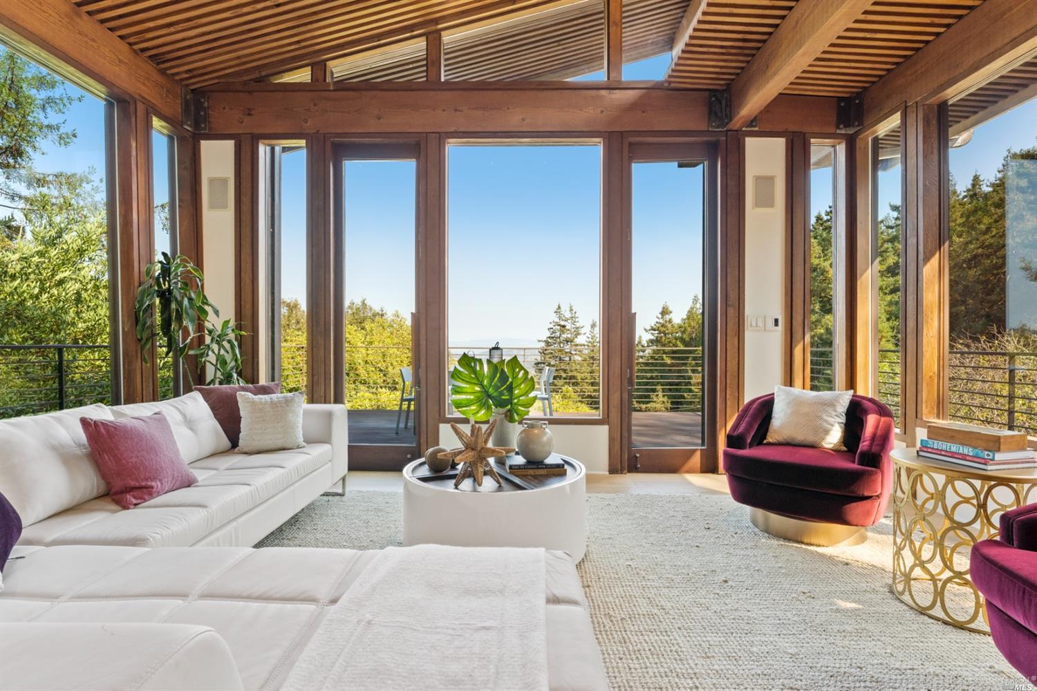 655 Edgewood Avenue Mill Valley, CA 94941 - Photo 33 of 85 a living room with furniture and floor to ceiling windows