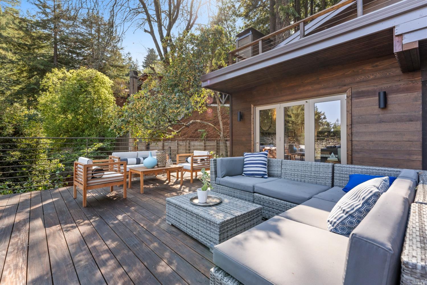 655 Edgewood Avenue Mill Valley, CA 94941 - Photo 42 of 85 a view of a patio with couches and a table and chairs with garden view