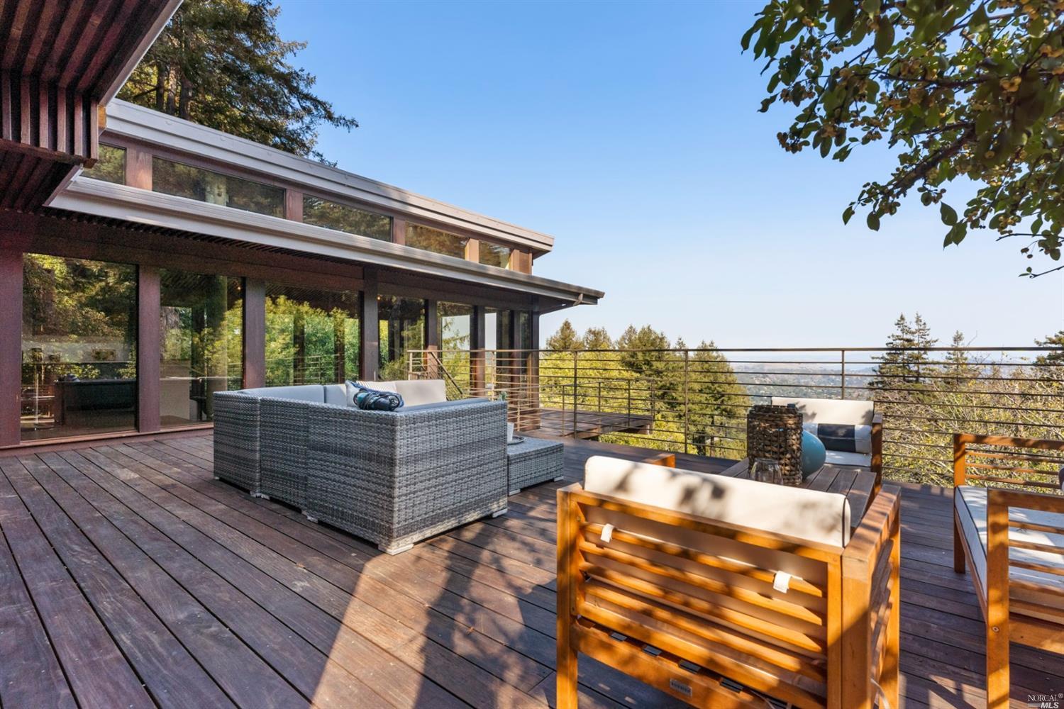 655 Edgewood Avenue Mill Valley, CA 94941 - Photo 43 of 85 a view of a roof deck with dining table and chairs with wooden floor