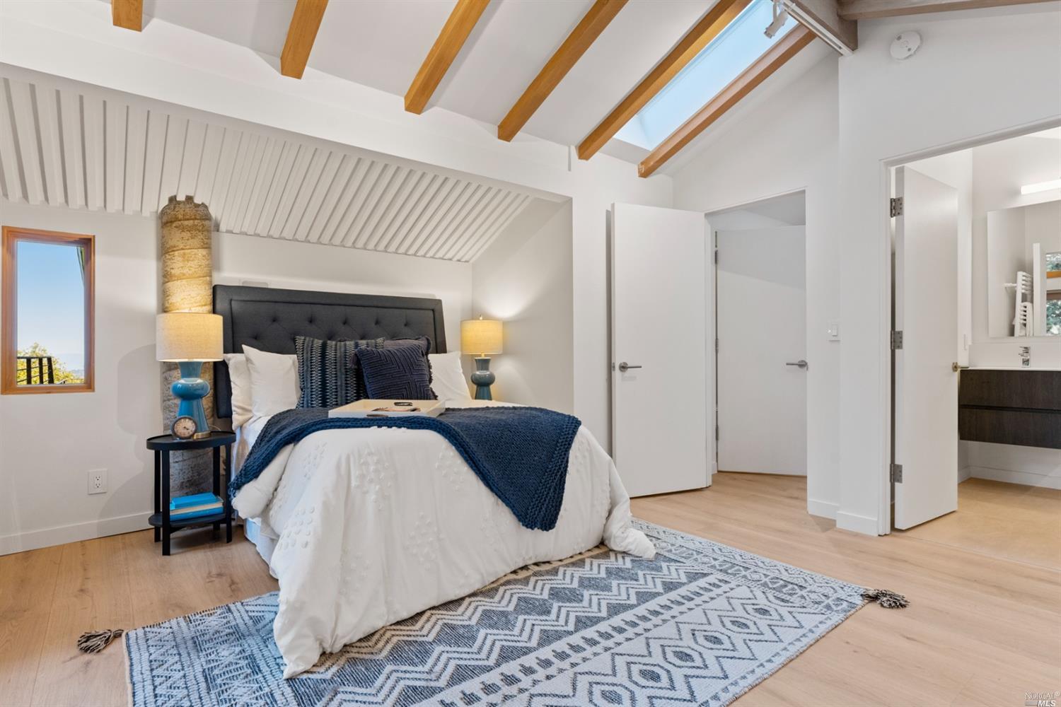 655 Edgewood Avenue Mill Valley, CA 94941 - Photo 48 of 85 a bedroom with a bed and wooden floor