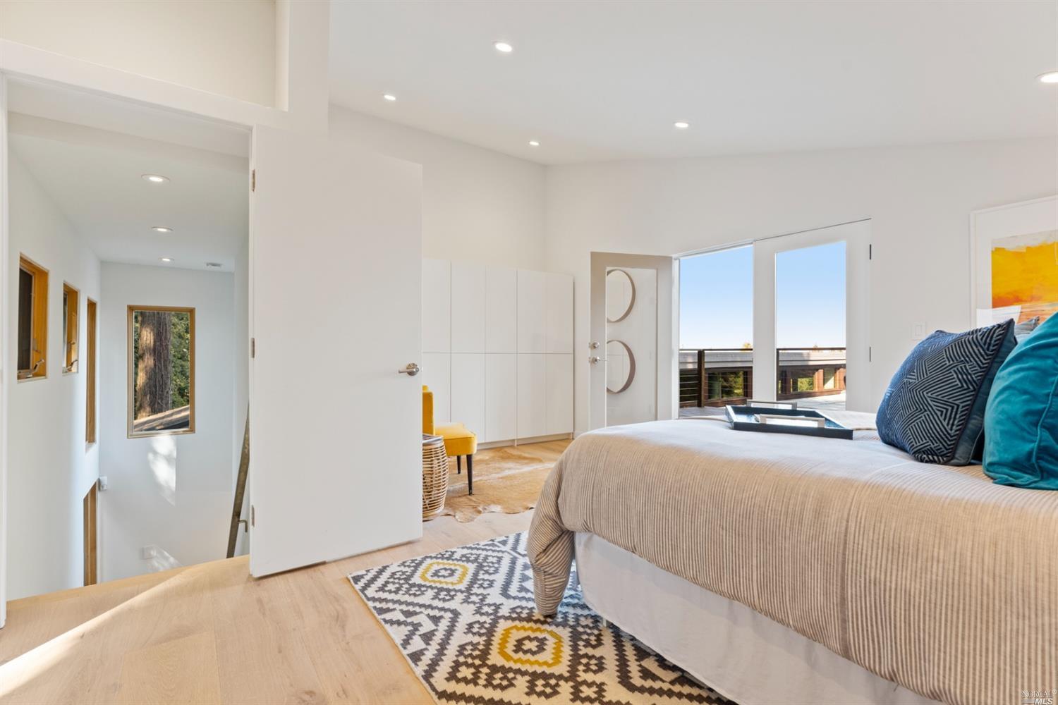 655 Edgewood Avenue Mill Valley, CA 94941 - Photo 55 of 85 a bedroom with a bed and a table