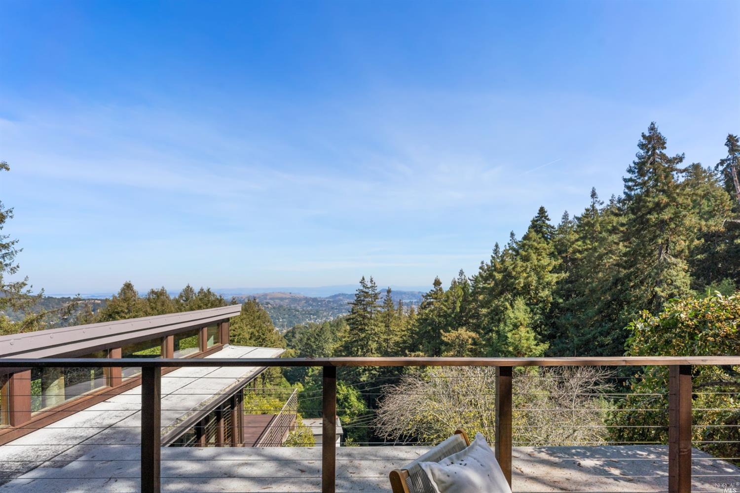 655 Edgewood Avenue Mill Valley, CA 94941 - Photo 59 of 85 a view of a balcony with chairs and wooden floor