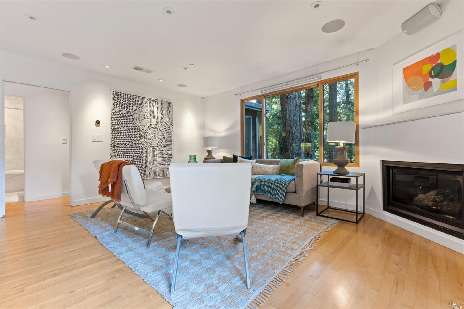 655 Edgewood Avenue Mill Valley, CA 94941 - Photo 72 of 85 a living room with furniture a rug and a fireplace