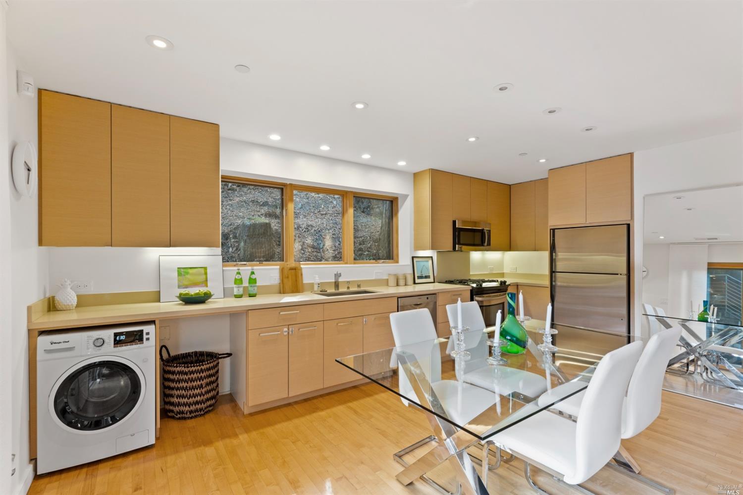 655 Edgewood Avenue Mill Valley, CA 94941 - Photo 76 of 85 a kitchen with stainless steel appliances granite countertop a sink a stove a refrigerator cabinets and living room view