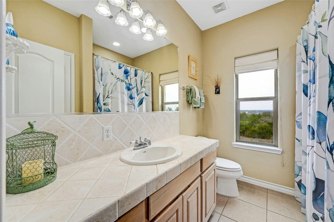 1370 Sunset View Fischer, TX 78623 - Photo 19 of 28 a bathroom with a sink toilet and shower