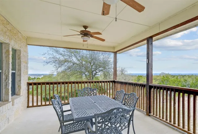 a view of a two chairs in the balcony