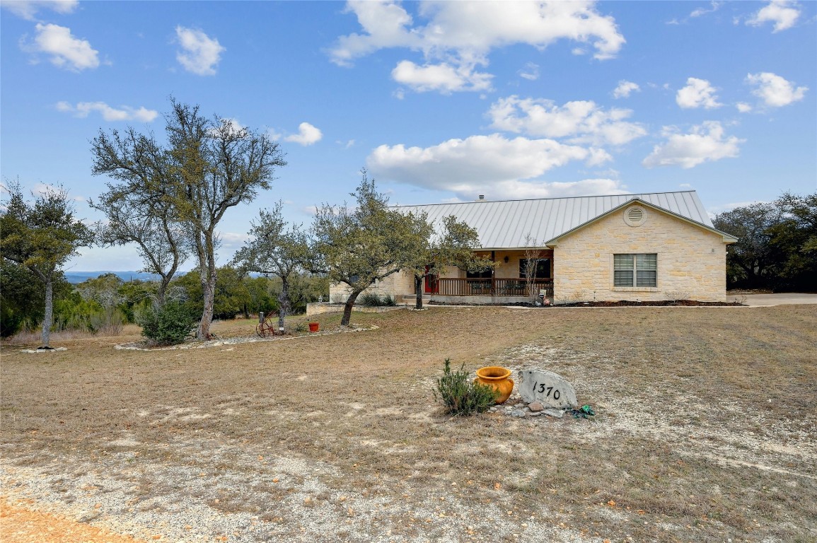 1370 Sunset View Fischer, TX 78623 - Photo 27 of 28 a view of a house with a patio