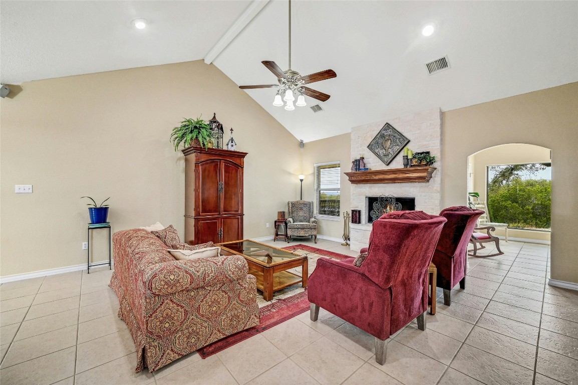 1370 Sunset View Fischer, TX 78623 - Photo 7 of 28 a living room with furniture a fireplace and a potted plant