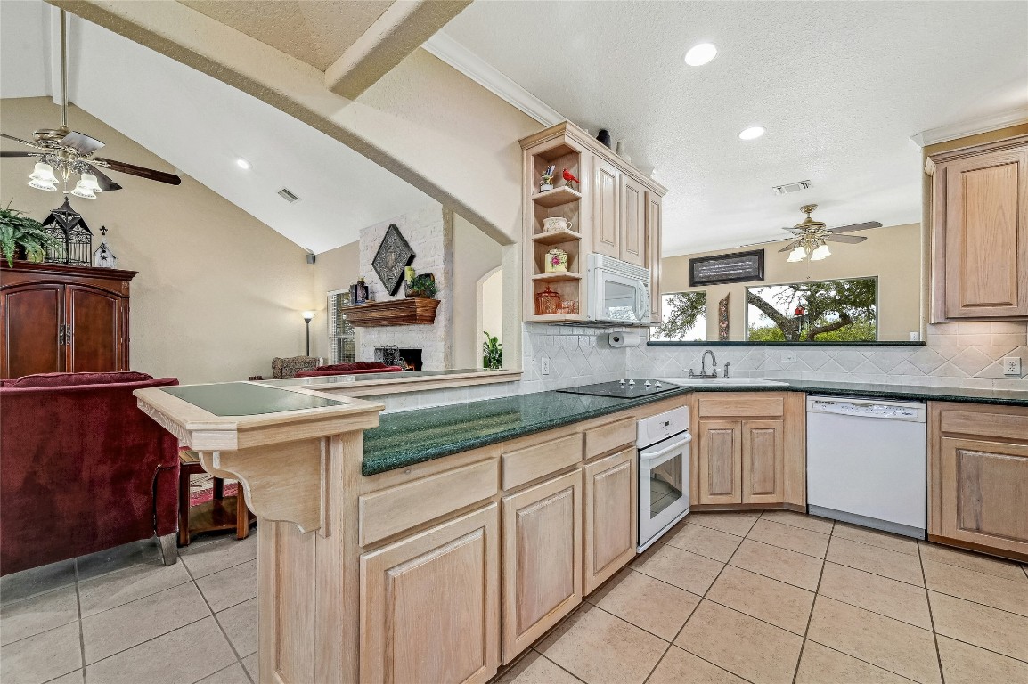 1370 Sunset View Fischer, TX 78623 - Photo 8 of 28 a kitchen with a sink and cabinets