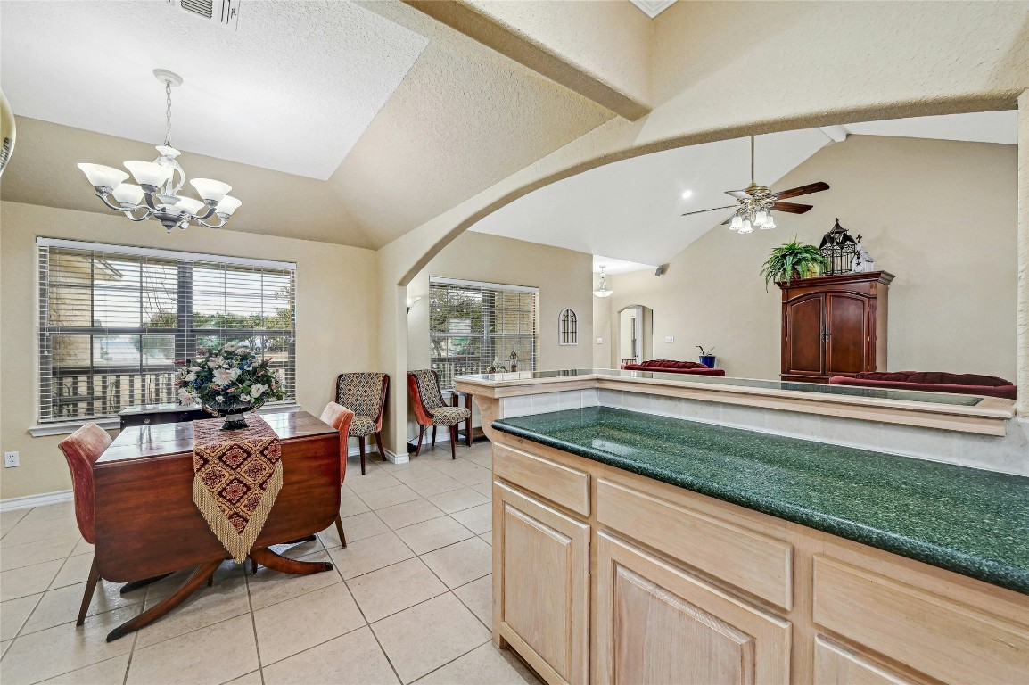 1370 Sunset View Fischer, TX 78623 - Photo 10 of 28 a living room with kitchen island furniture and a chandelier