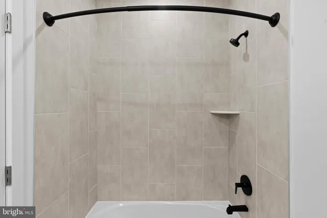 a bathroom with a shower and a shower