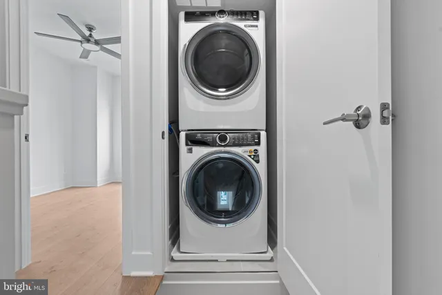 a view of a hallway with washer and dryer