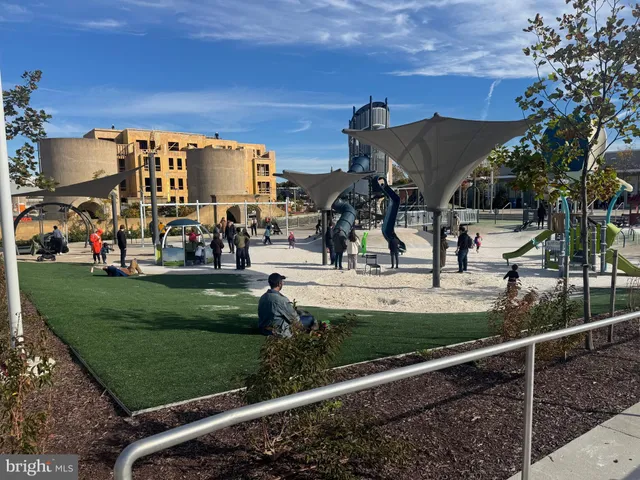 a view of a park with swings and slides