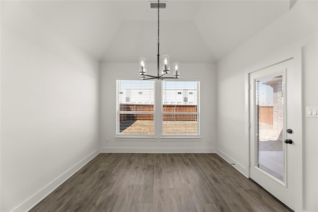 1314 Comal Drive Forney, TX 75126 - Photo 12 of 30 a view of empty room with wooden floor and fan