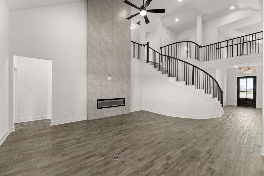 1314 Comal Drive Forney, TX 75126 - Photo 14 of 30 a view of entryway and hall with wooden floor