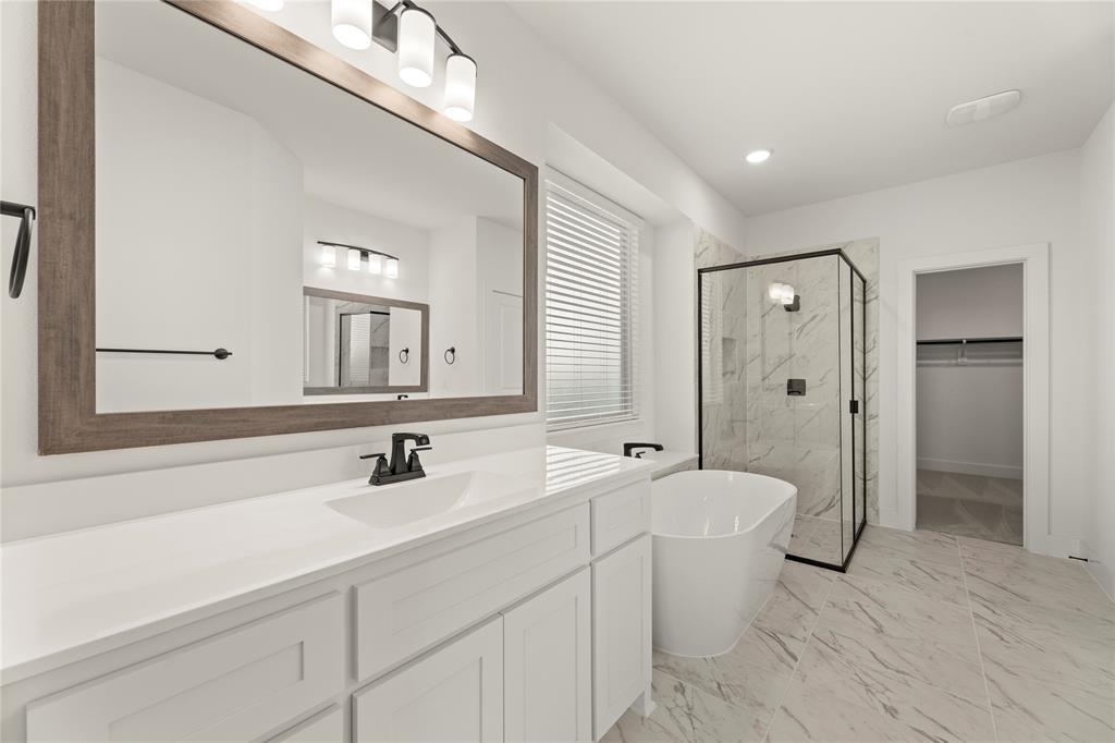 1314 Comal Drive Forney, TX 75126 - Photo 17 of 30 a bathroom with a double vanity sink mirror and double