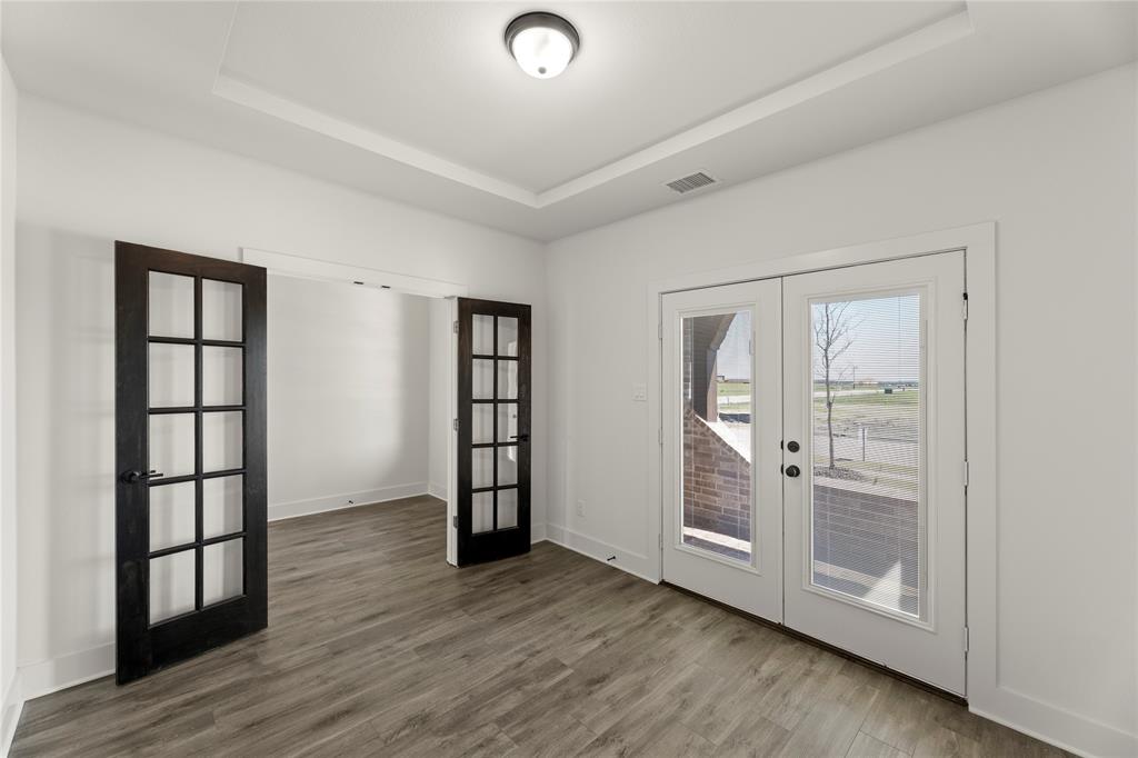 1314 Comal Drive Forney, TX 75126 - Photo 4 of 30 wooden floor in an empty room with a window