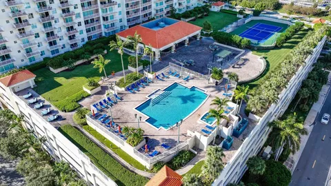a view of swimming pool with outdoor seating