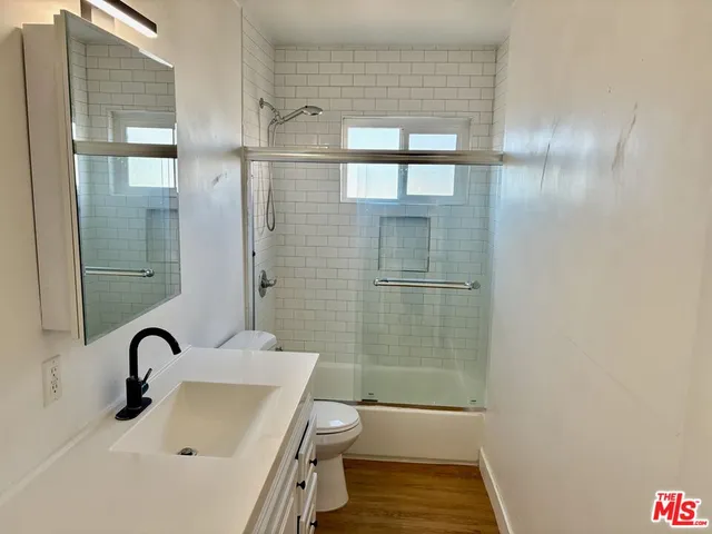 a bathroom with a sink and mirror