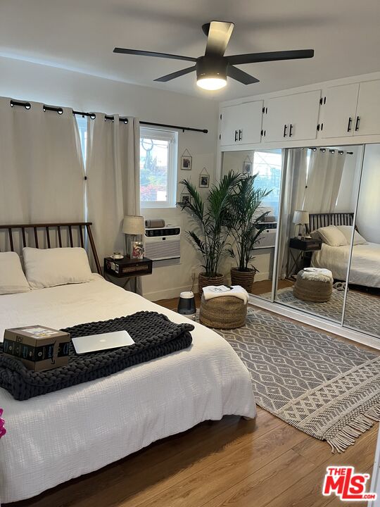 3824 Keystone Avenue, Unit 7 Culver City, CA 90232 - Photo 2 of 8 a spacious bedroom with a bed a couch and potted plant with the outer view