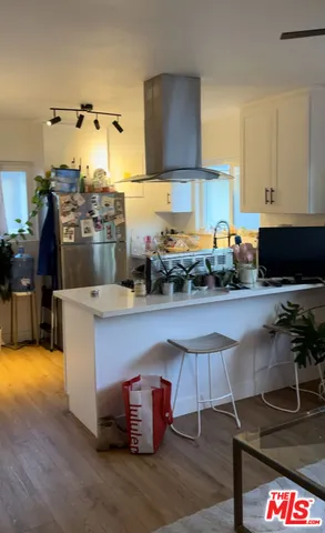 a kitchen with stainless steel appliances granite countertop a stove and a sink