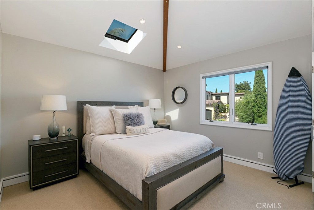 609 Seaward Road Corona del Mar, CA 92625 - Photo 14 of 22 a bedroom with a bed and a window