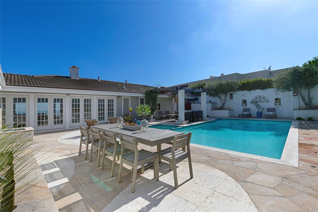 609 Seaward Road Corona del Mar, CA 92625 - Photo 18 of 22 a view of a house with backyard porch and sitting area
