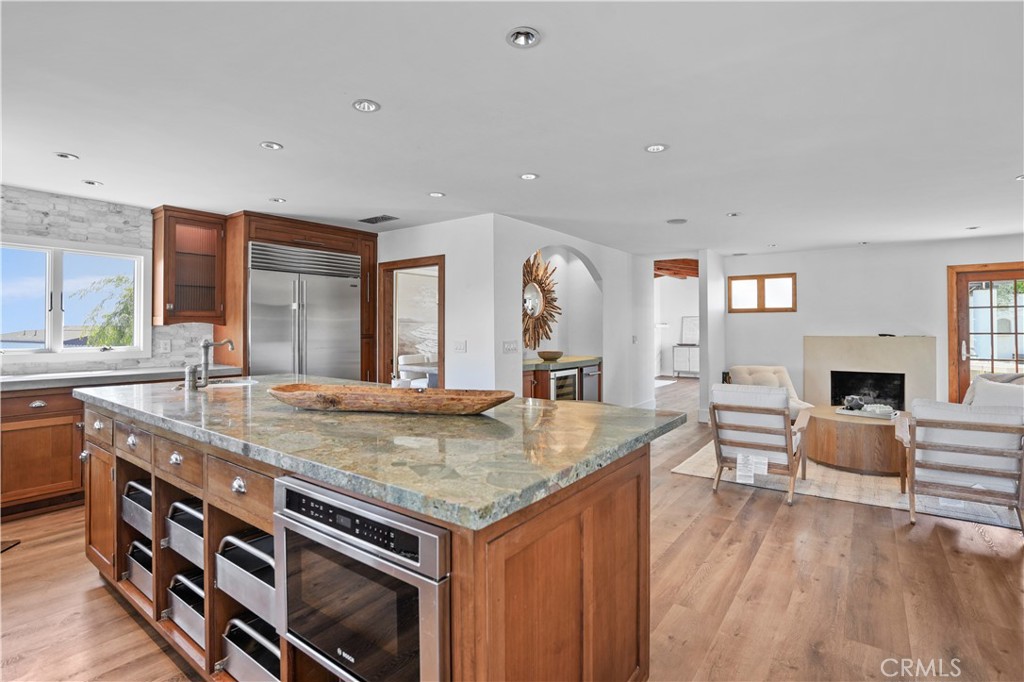 609 Seaward Road Corona del Mar, CA 92625 - Photo 3 of 22 a kitchen with stainless steel appliances granite countertop a stove and a sink