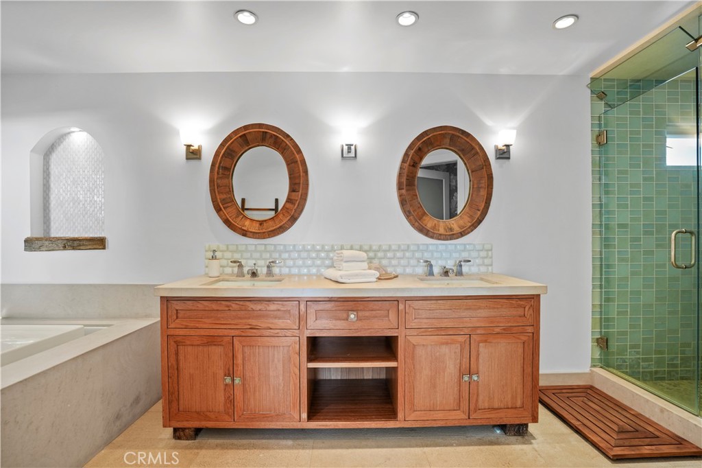 609 Seaward Road Corona del Mar, CA 92625 - Photo 9 of 22 a bathroom with a sink and a mirror