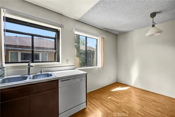 a kitchen with a sink and large window