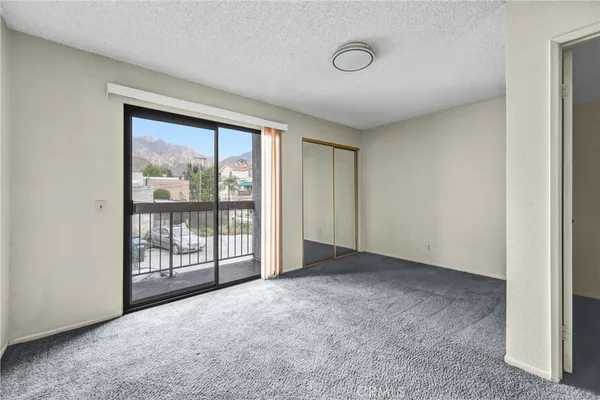 a view of an empty room with a sliding door