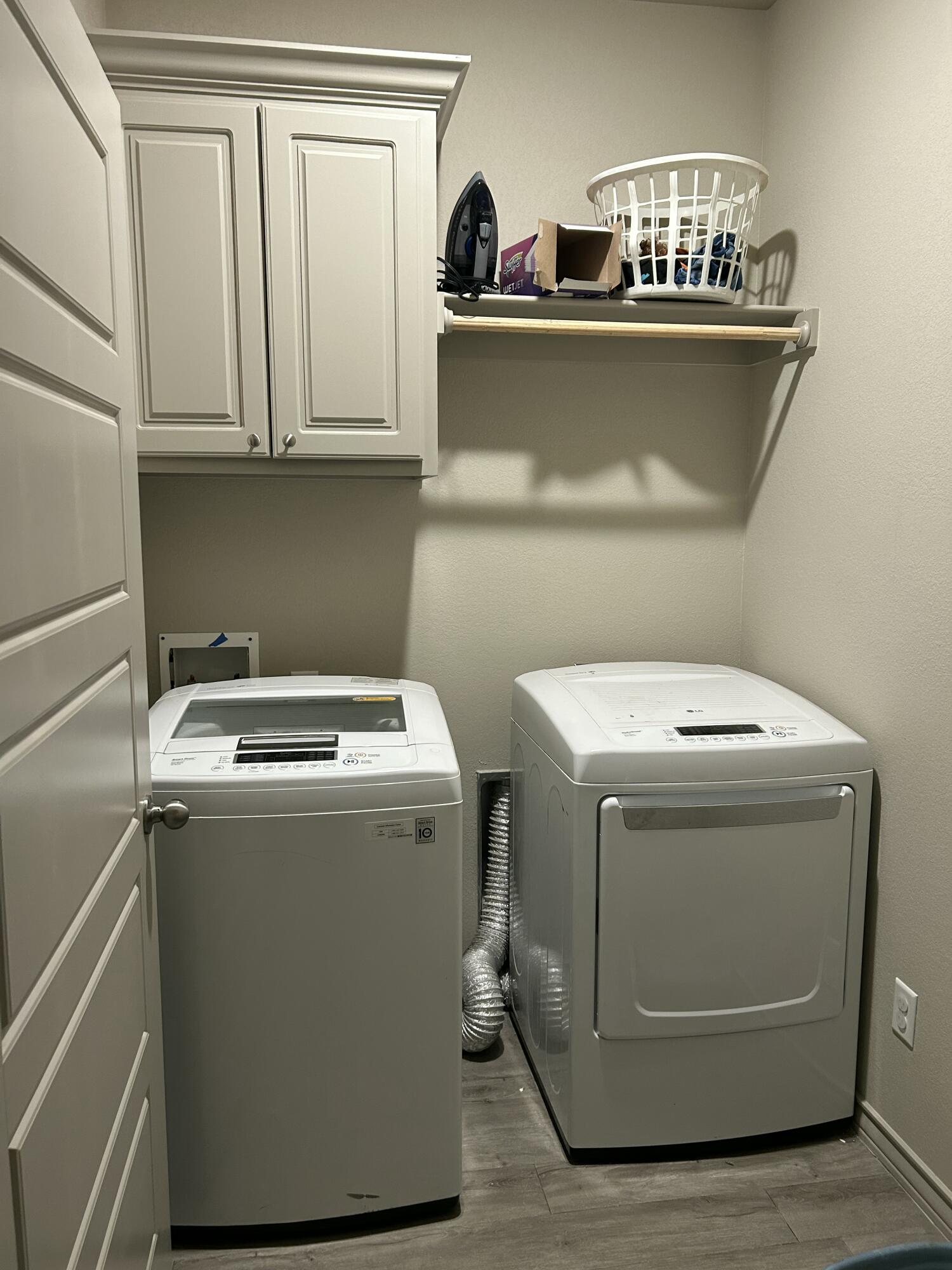 7020 22nd Street Lubbock, TX 79407 - Photo 15 of 28 a utility room with dryer and washer