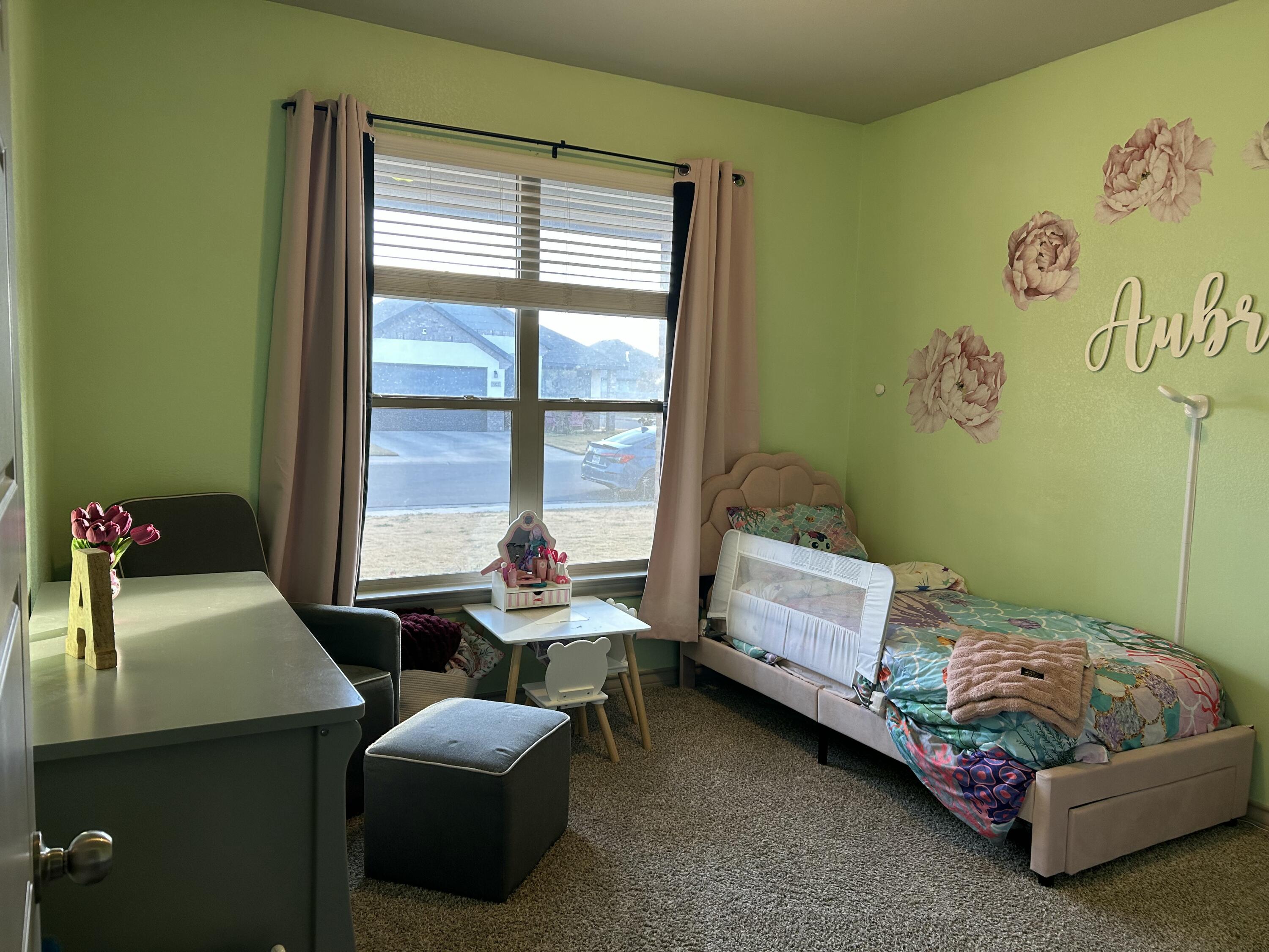 7020 22nd Street Lubbock, TX 79407 - Photo 20 of 28 a bedroom with a bed and a window