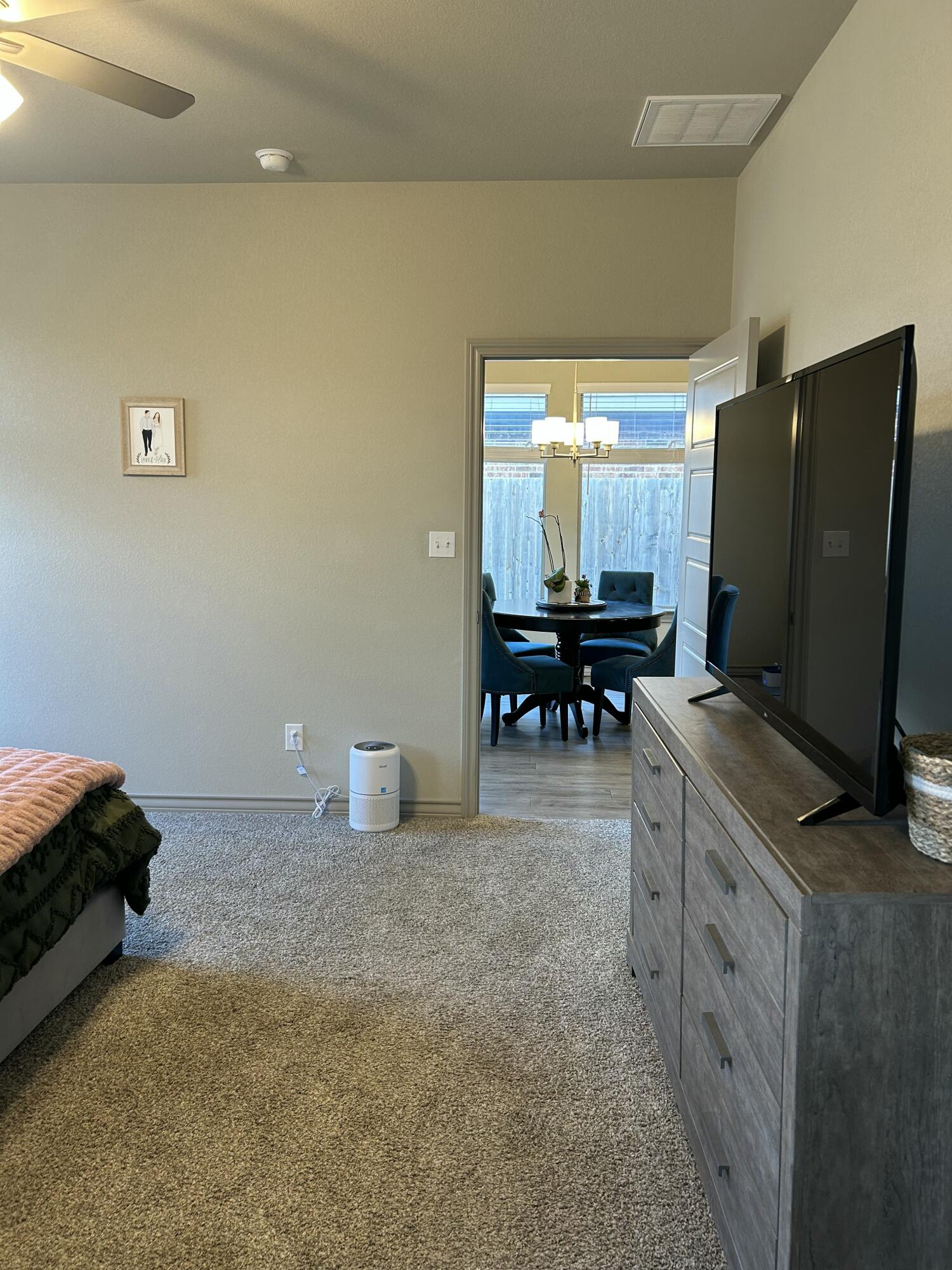 7020 22nd Street Lubbock, TX 79407 - Photo 23 of 28 a kitchen with stainless steel appliances a stove top oven a sink a dining table and chairs