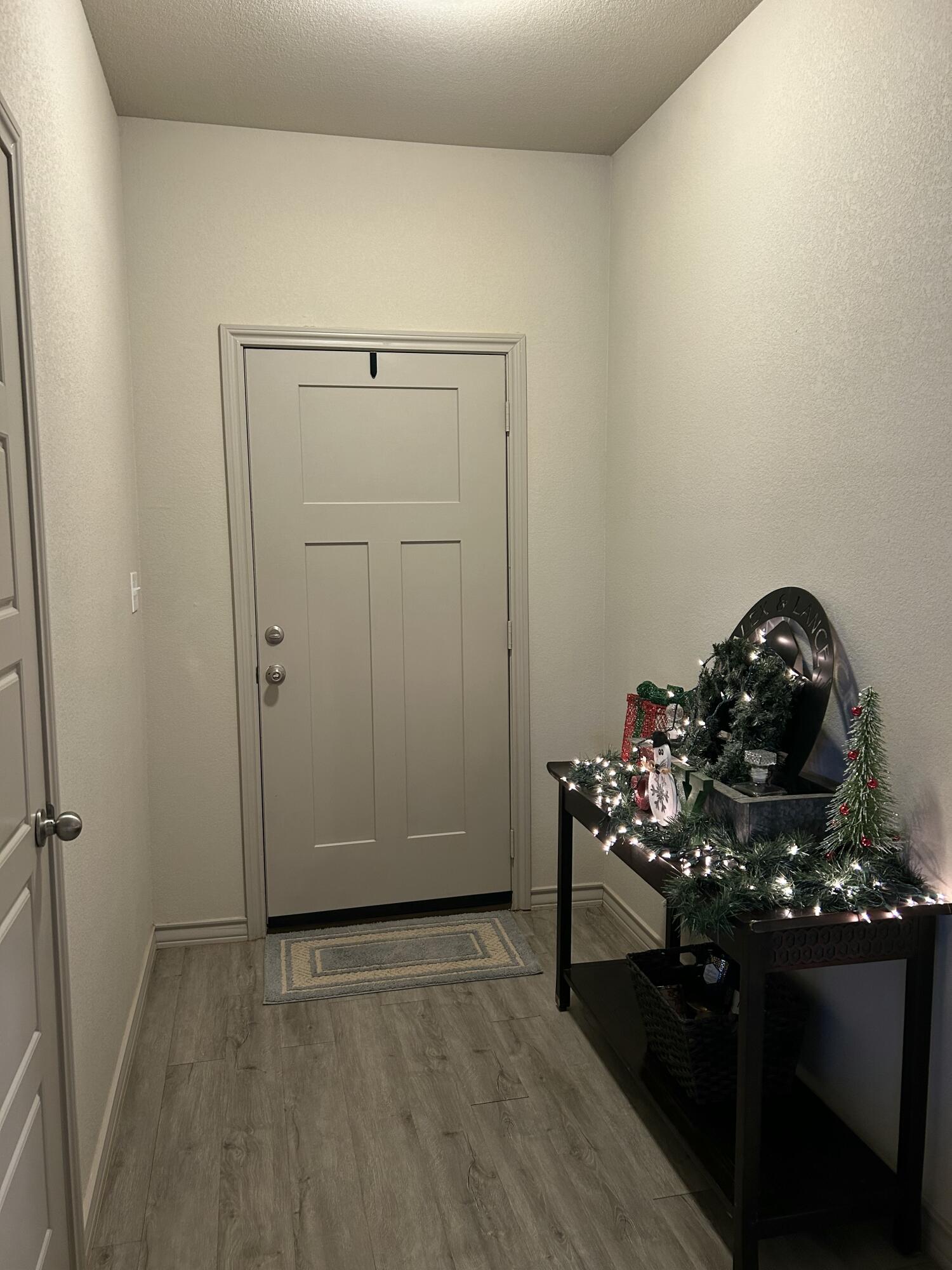 7020 22nd Street Lubbock, TX 79407 - Photo 6 of 28 a view of a livingroom with wooden floor and a sink