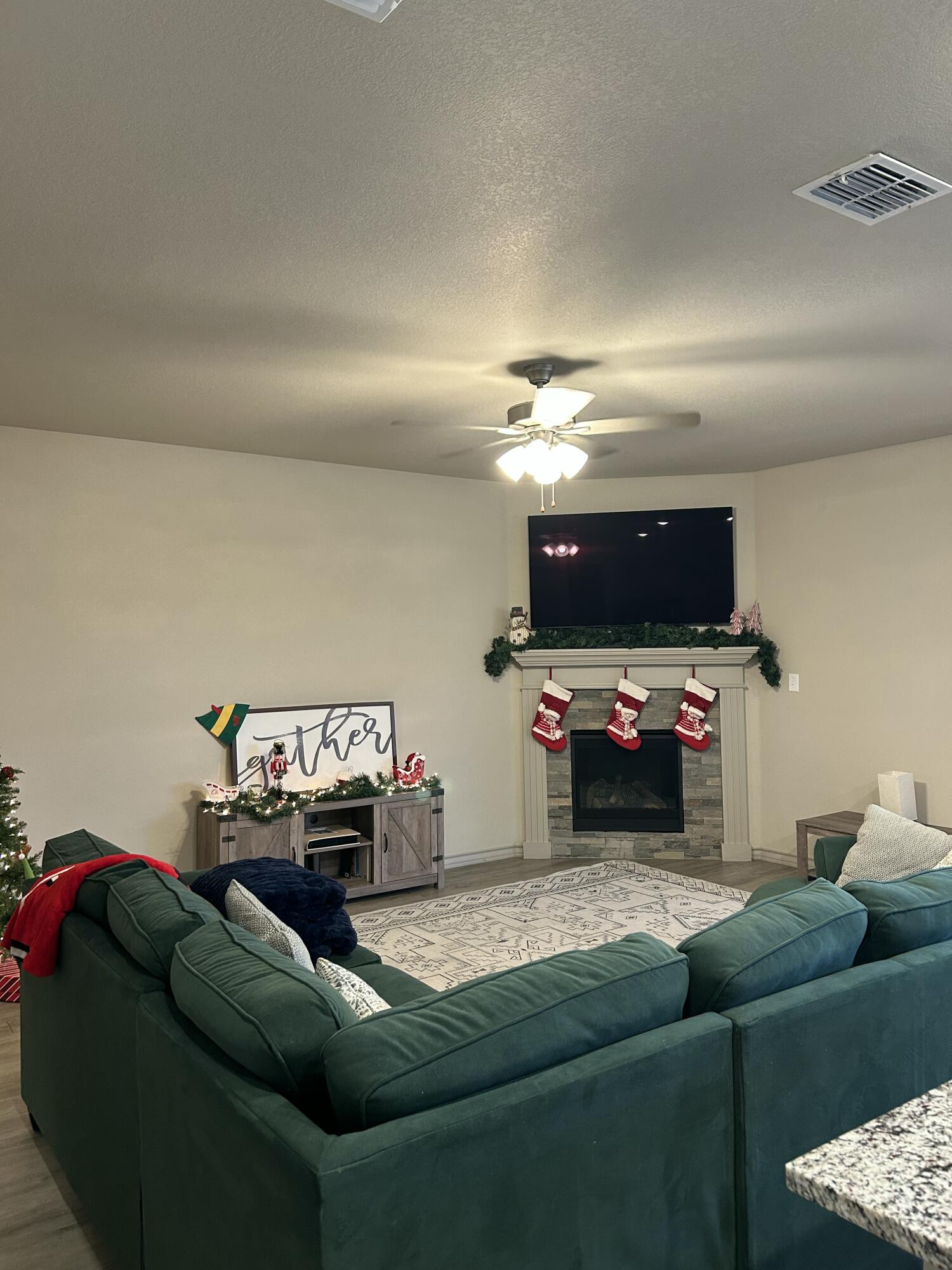 7020 22nd Street Lubbock, TX 79407 - Photo 9 of 28 a living room with furniture and a flat screen tv