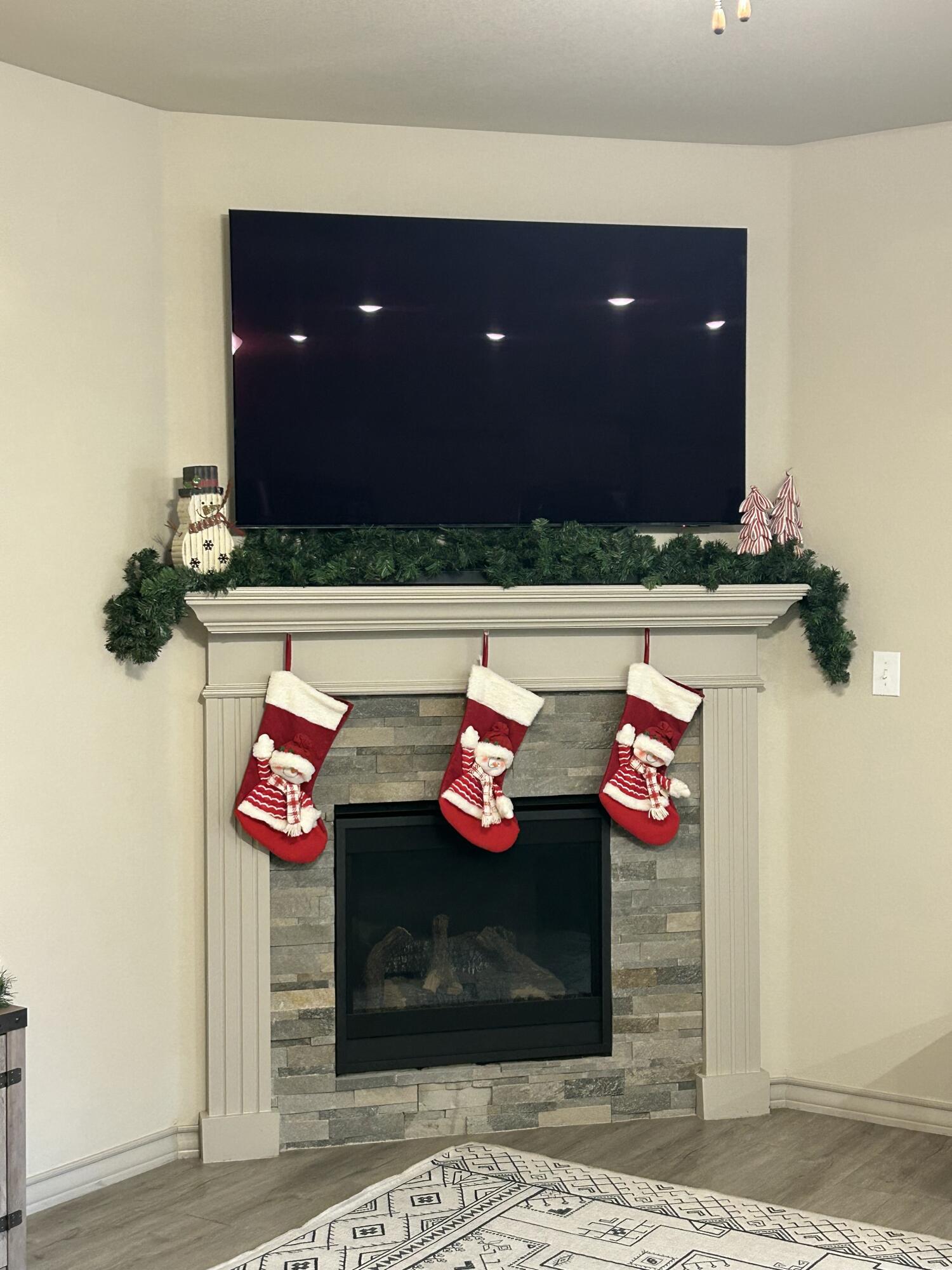 7020 22nd Street Lubbock, TX 79407 - Photo 10 of 28 a living room with furniture and a wooden floor