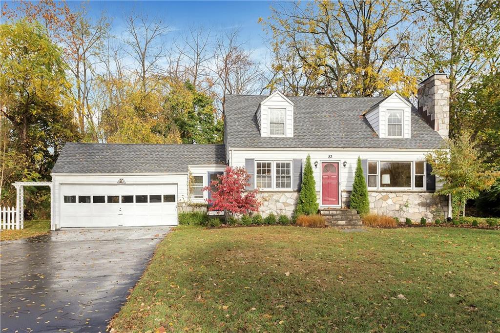 a front view of a house with yard