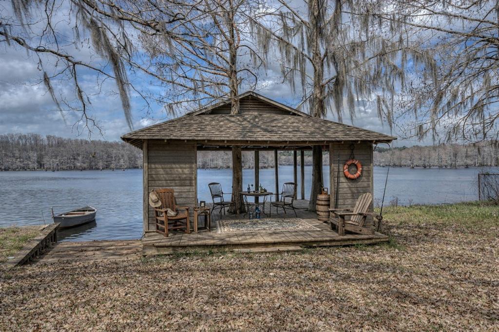 306 Pine Street Heflin, LA 71039 - Photo 13 of 14 a backyard of a house with seating space
