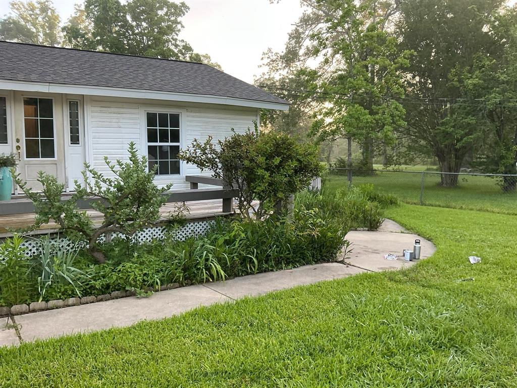 306 Pine Street Heflin, LA 71039 - Photo 5 of 14 a front view of a house with a garden
