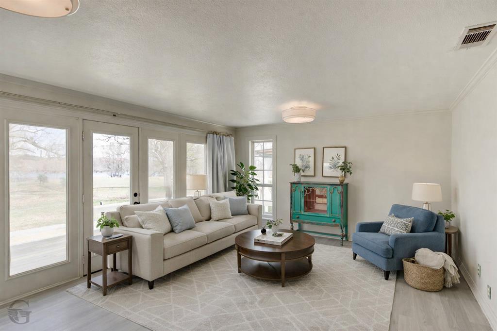 306 Pine Street Heflin, LA 71039 - Photo 6 of 14 a living room with furniture and a large window