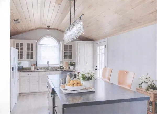 a view of a dining room with furniture and window