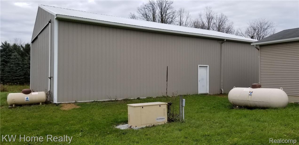 2169 Cove Road Goodells, MI 48027 - Photo 54 of 65 Rear/Side View Of Pole Barn, Propane Tanks, & 12kw Guardian Standby Generator