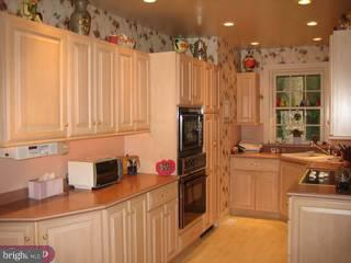 504 Valley Road Havertown, PA 19083 - Photo 3 of 6 a kitchen with a sink stove and cabinets