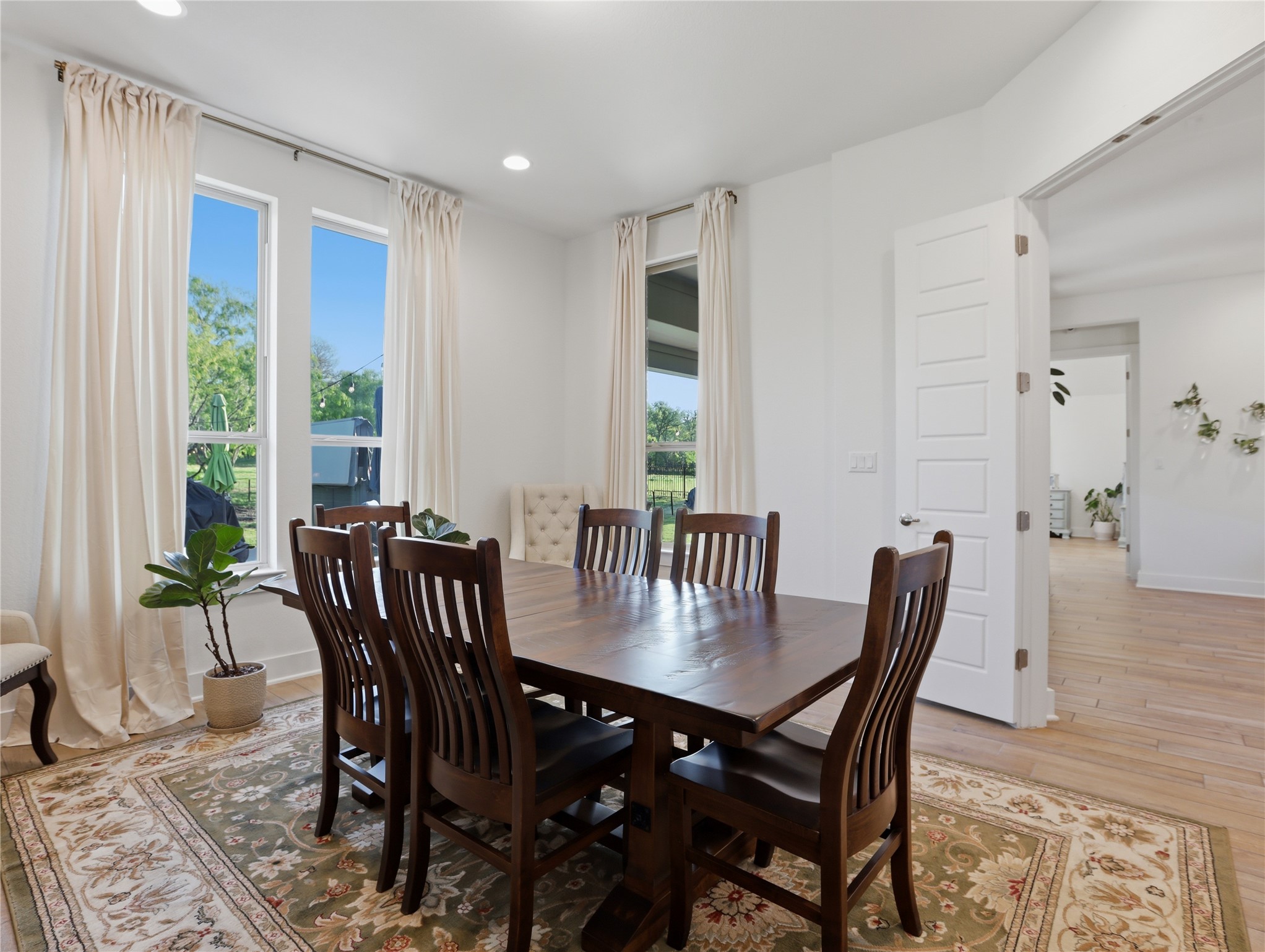316 Raptor Beak Way Cedar Creek, TX 78612 - Photo 14 of 30 a view of a dining room with furniture window and wooden floor