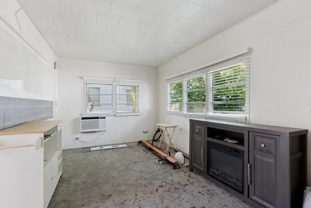 a kitchen with a stove a sink and a refrigerator
