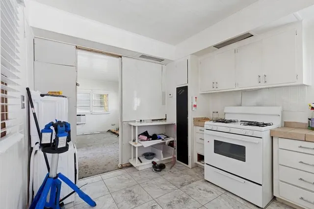 a view of a kitchen with appliances and cabinets