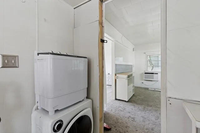 a view of a storage & utility room with washer and dryer