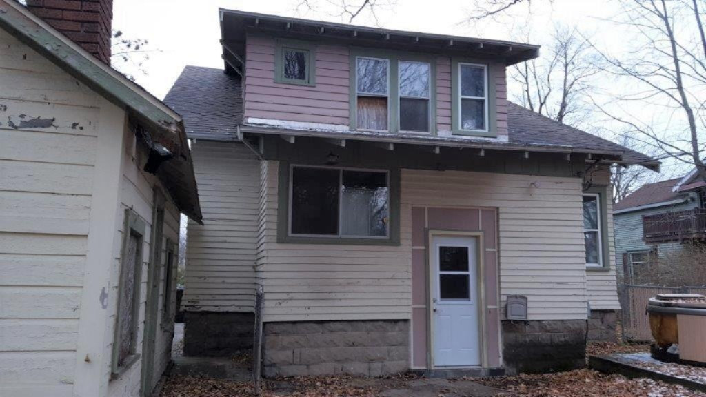 121 Rust Avenue Big Rapids, MI 49307 - Photo 12 of 16 back with boarded upstairs window
